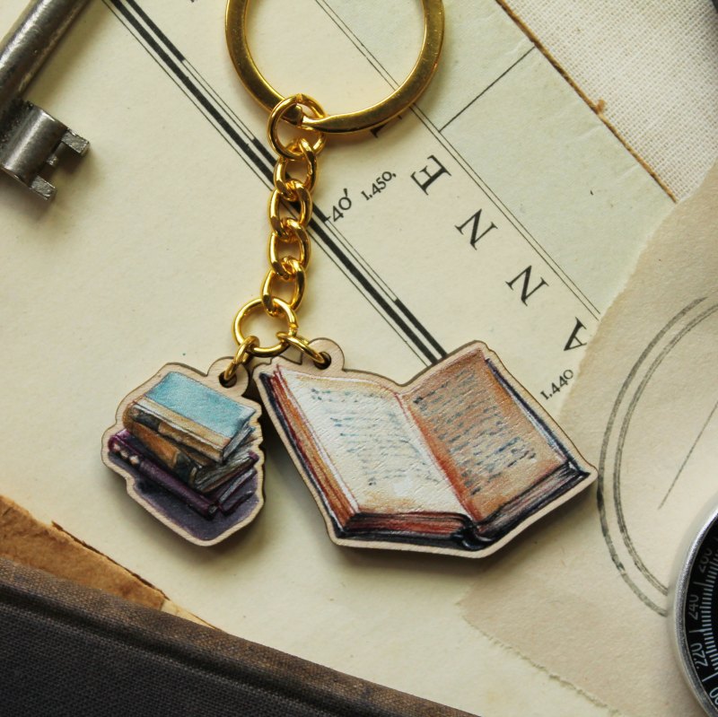 a keyring with mini illustrations of books