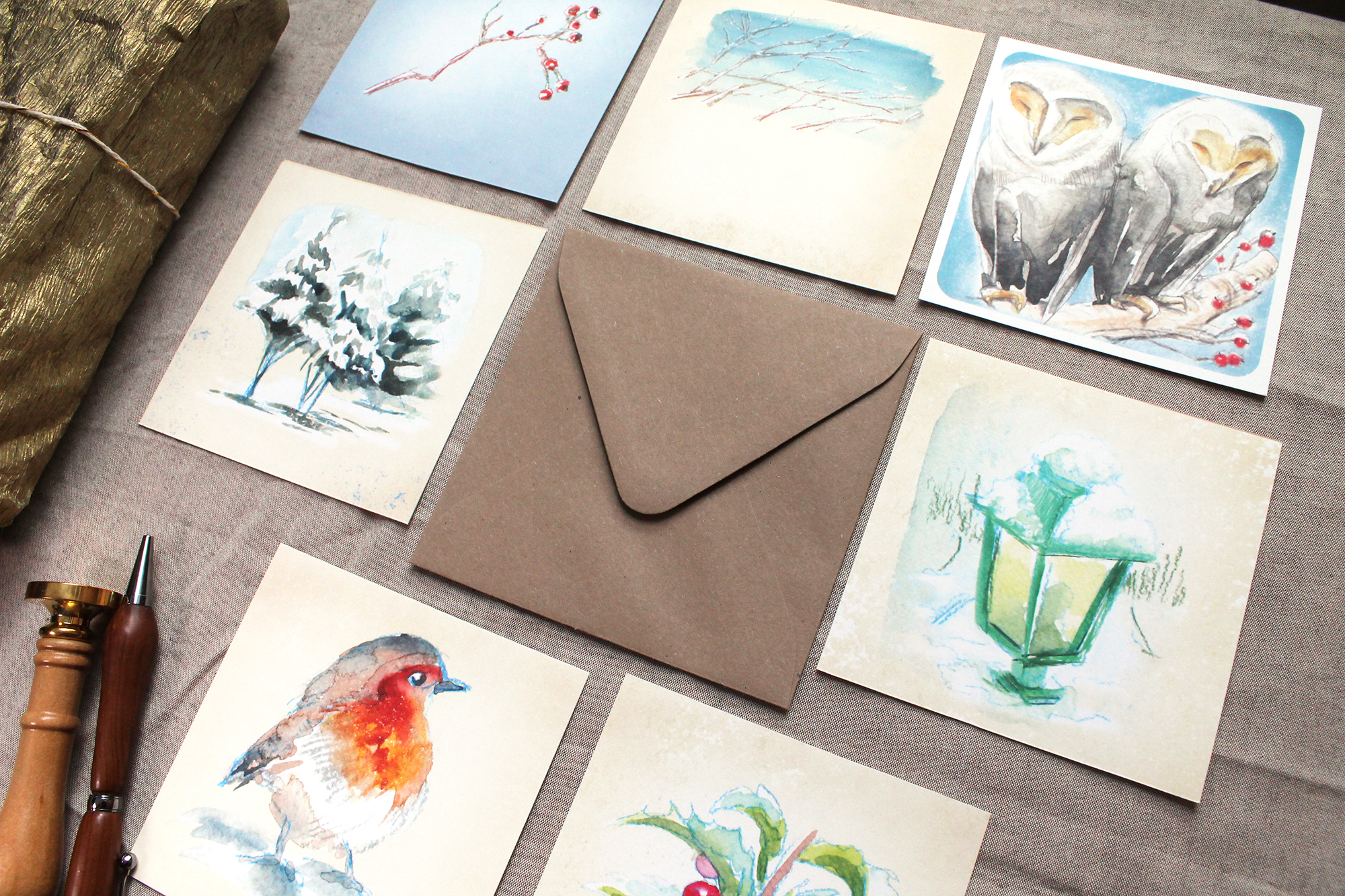 icy coloured illustrated cards in flatlay